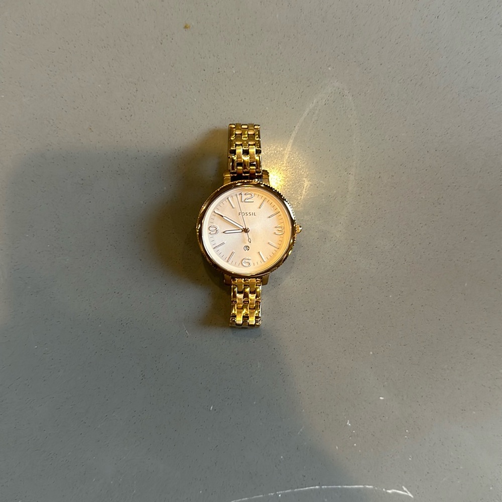 Gold fossil watch